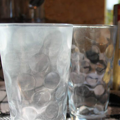 How to remove hard water deposits from glassware